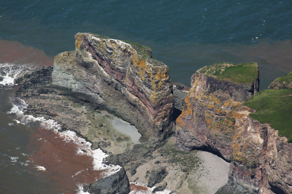 Cape Split on the Bay of Fundy, Nova Scotia, Canada. The cape is photographed with the tide about four hours from full flood. Photo by Eric with help from Andrew Robertson, piloting his Cessna 172.